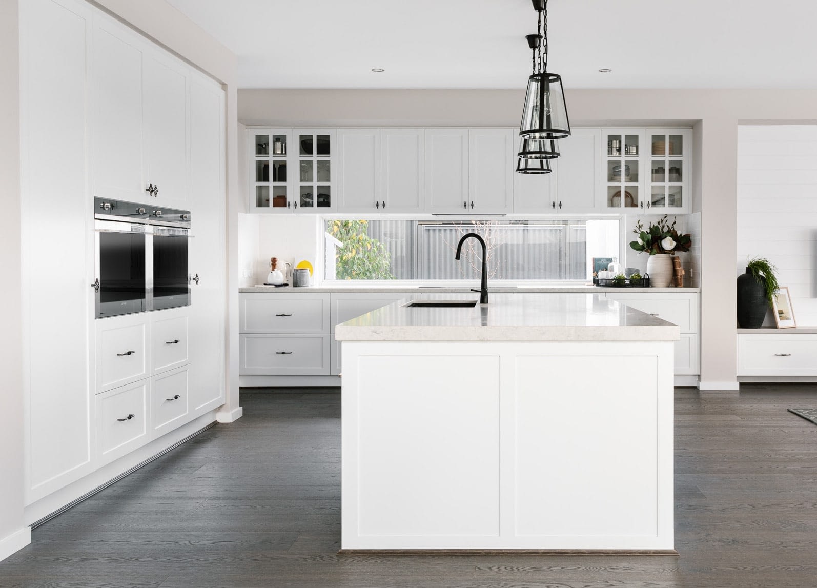 Metricon White Hamptons Kitchen With Shaker Style Cabinets And Black Handles 