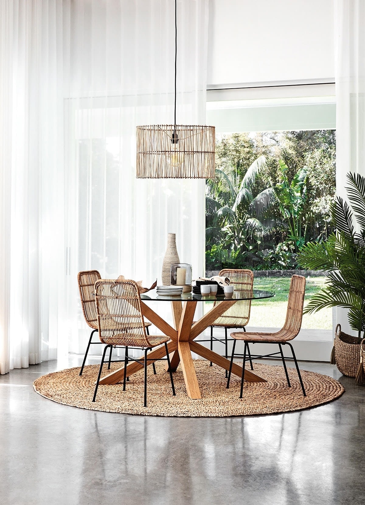 Round Jute Rug Under Glass Dining Table From Freedom With Coastal Dining Chairs 